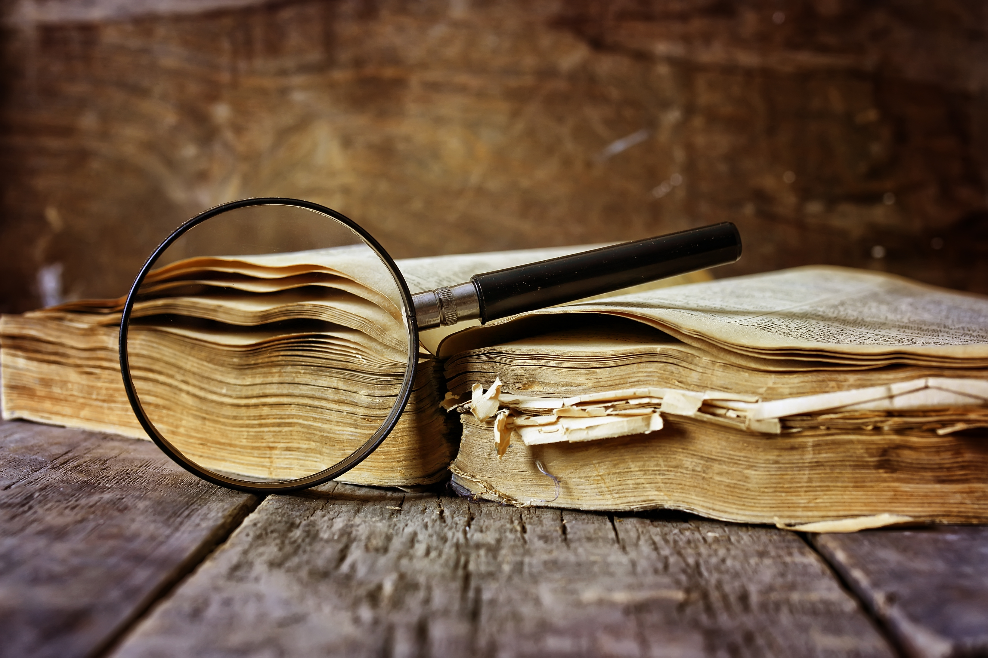 An old book and a magnifying glass