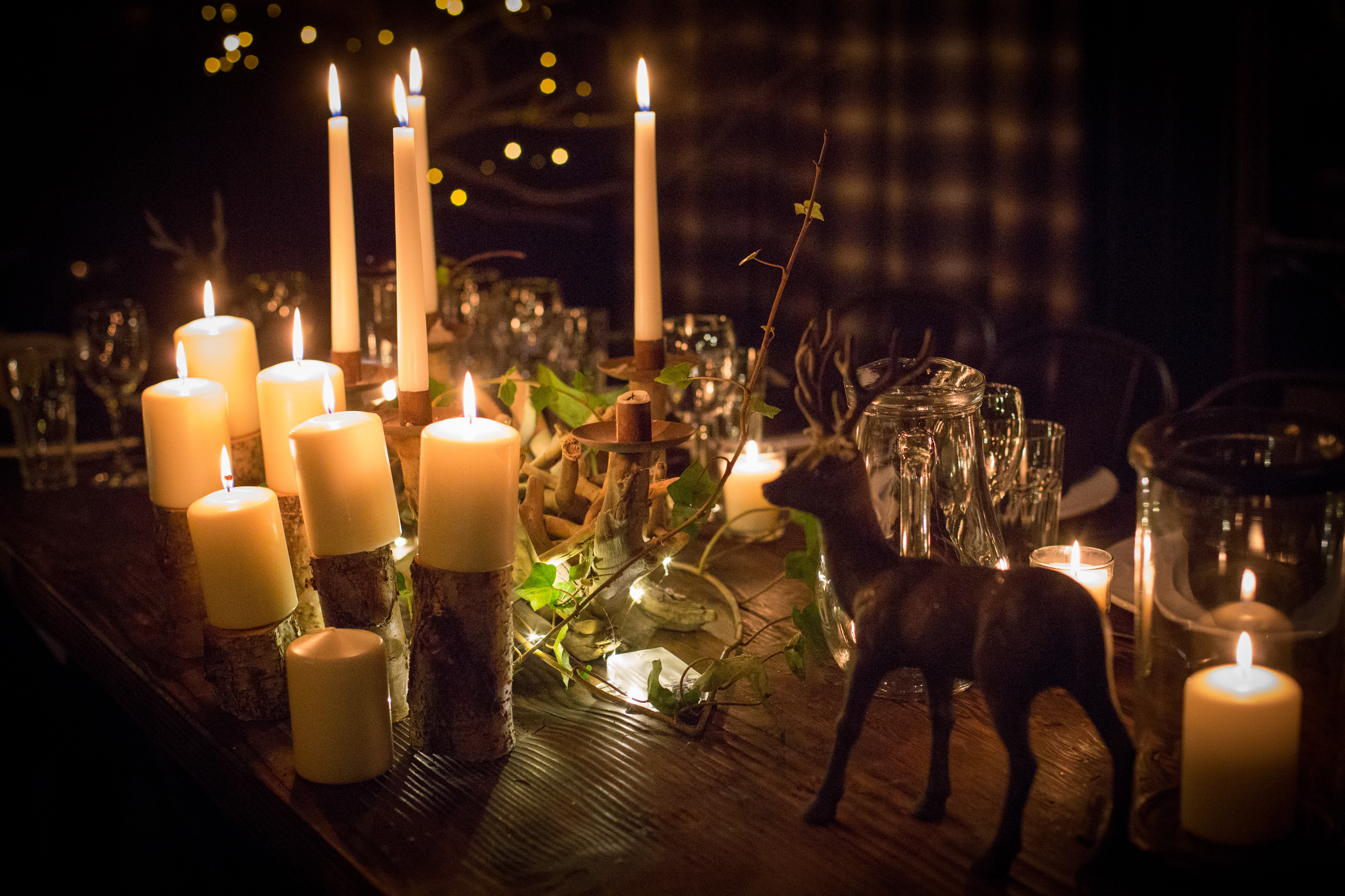 A table decorated with candles and ornaments